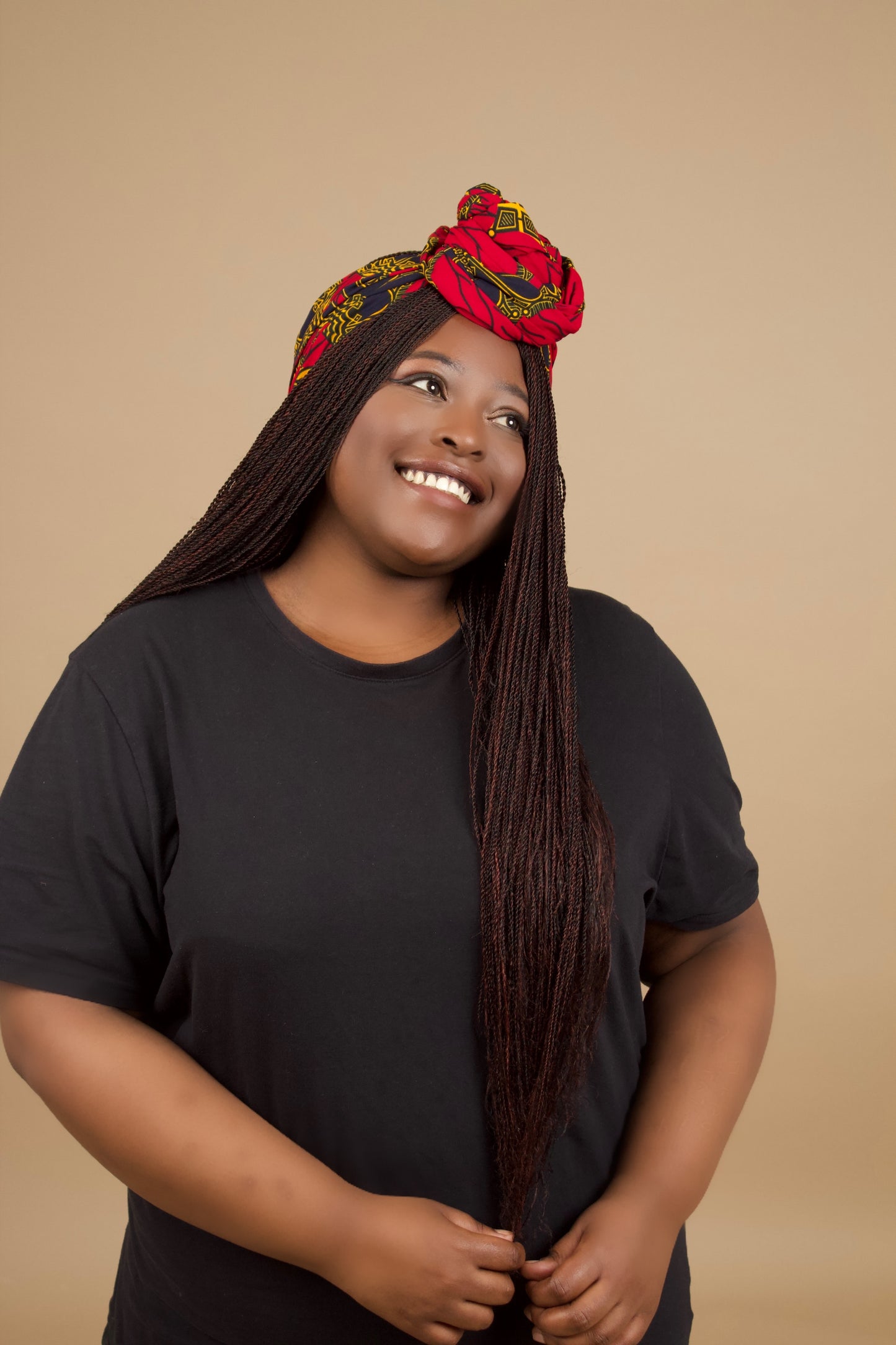 The Jalingo African Print Ankara Head Wrap is a lightweight African Print hair accessory made from ethically produced cotton. The Ankara wax print is a gorgeous red, yellow and black pattern. Designed in England Made in Nigeria.