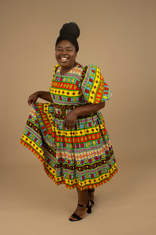The Akala African Print Skater Dress is crafted from sustainable wax print and features two side pockets in a repeated multi-coloured geometric Kente pattern from cotton. Designed in England Made in Nigeria. Available in standard and plus sizes (UK 8-32).