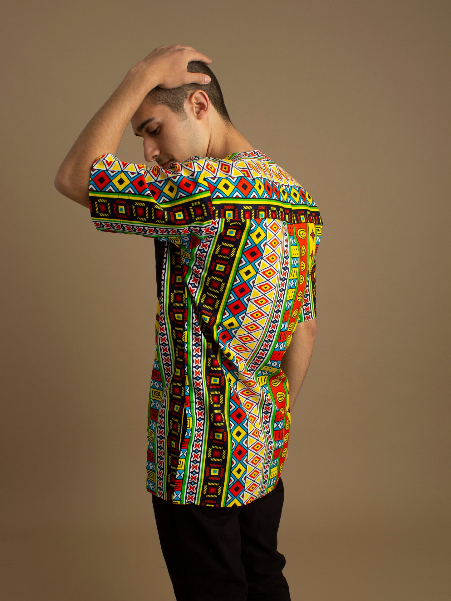 The Akala African Print Kaftan Top is ethically printed in a repeated multicolored geometric Kente African pattern with a Matte Black trim, wax printed body shirt made from sustainable Ankara wax printed cotton.. Designed in England Made in Nigeria. Available in standard and plus sizes (UK XS-5XL).