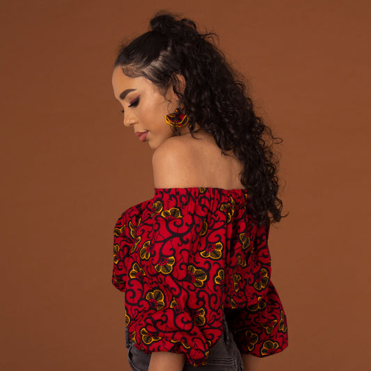 Off-shoulder African print crop top with three-quarter balloon sleeves and elasticated waist, arms and neckline in red and yellow ankara wax print