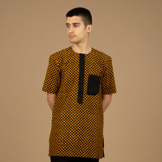 Vero African Print Kaftan Top is an ethically printed Matte Black Trimmed, Wax printed body style men's Kaftan top made from sustainably selected Cotton Ankara wax print in a repeated geometric brown and yellow African print pattern. Designed in England Made in Nigeria.