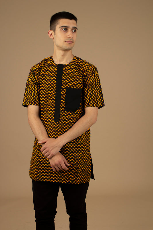 Vero African Print Kaftan Top is an ethically printed Matte Black Trimmed, Wax printed body style men's Kaftan top made from sustainably selected Cotton Ankara wax print in a repeated geometric brown and yellow African print pattern. Designed in England Made in Nigeria.