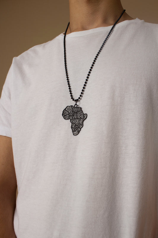 Unisex necklace with a African Map pendant featuring black metallic textured detailing and a metallic chain link. Available in one-size, Designed in England Made in Nigeria.