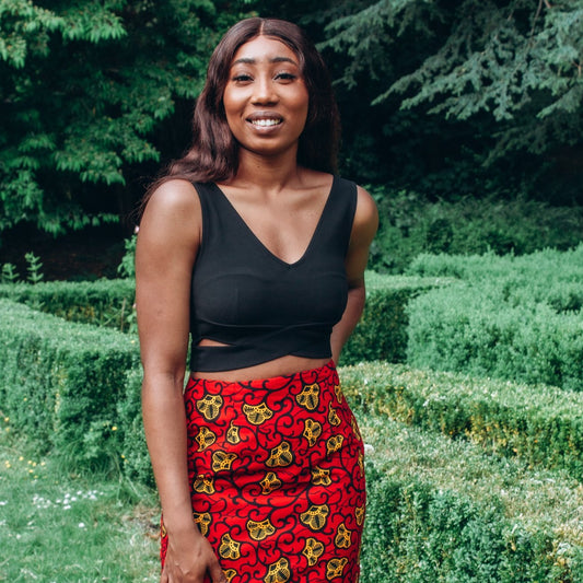 Red, yellow and black African print high waisted pencil skirt in a floral pattern, made from sustainably sourced Ankara wax print.
