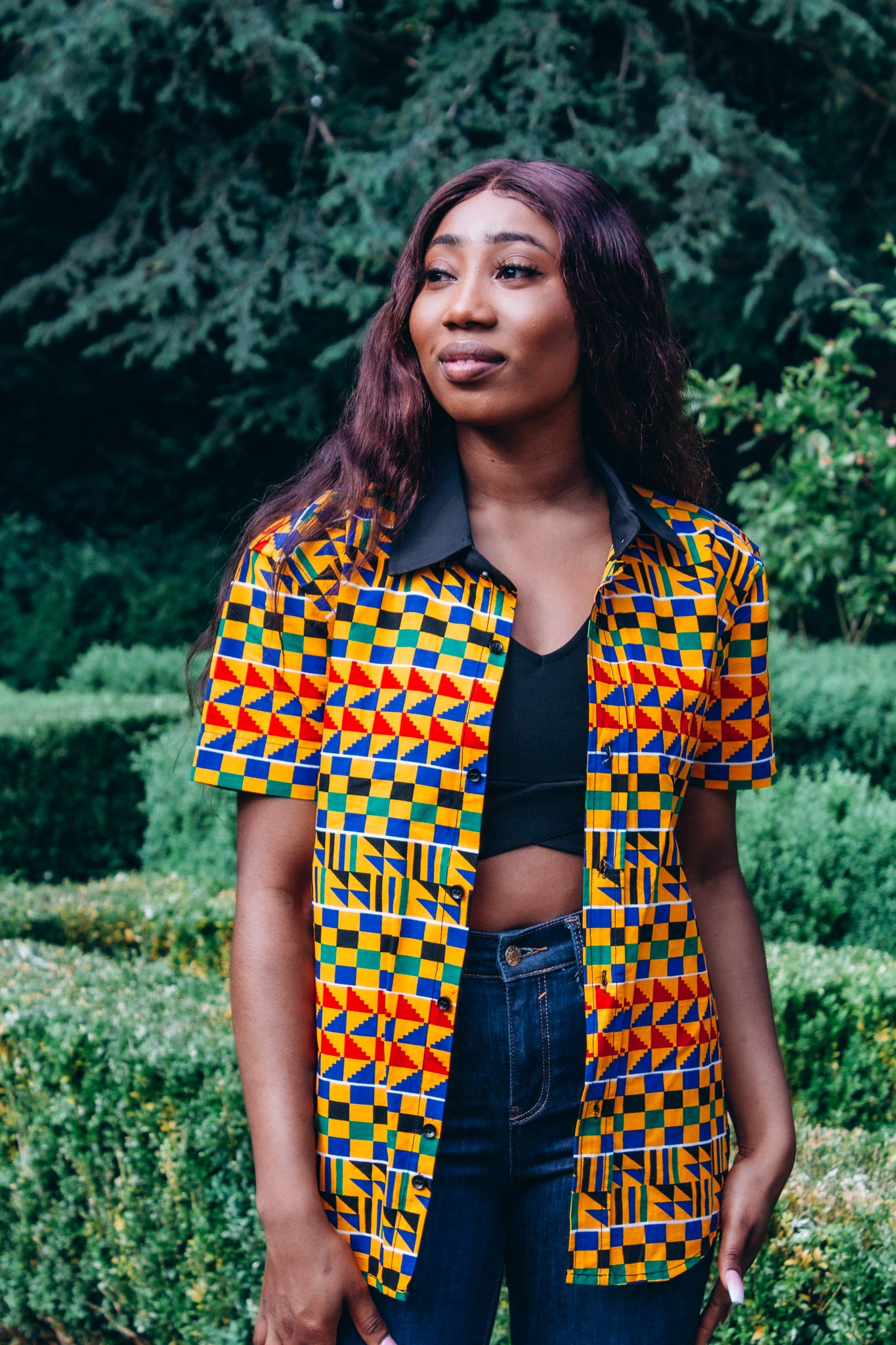 Kente African Printed black round neck collared slim fitted Shirt made from yellow , red, blue, green, white and black Kente African Ankara wax printed Fabric.