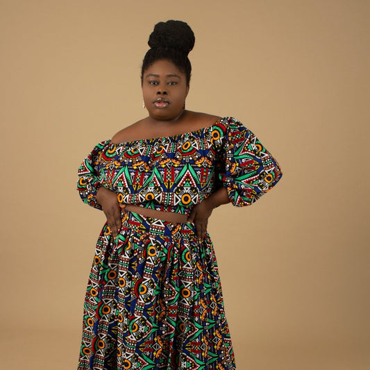 The Ifemi Floor Length African Print High Waisted Maxi Skirt with an enforced waistband and zip in a vibrant Ankara wax, geometric multicolored pattern using sustainable ethically sourced Cotton, designed in England Made in Nigeria.