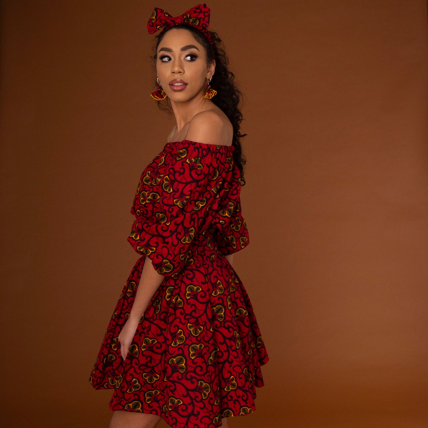 African print balloon sleeve crop top and matching high waisted flare skirt a striking red, yellow and black ankara fabric