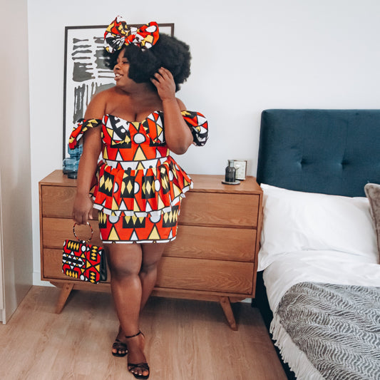 Red, pastel yellow, white and black African printKnee length pencil skirt, in oversized geo-shaped pattern made from sustainably sourced Ankara wax print