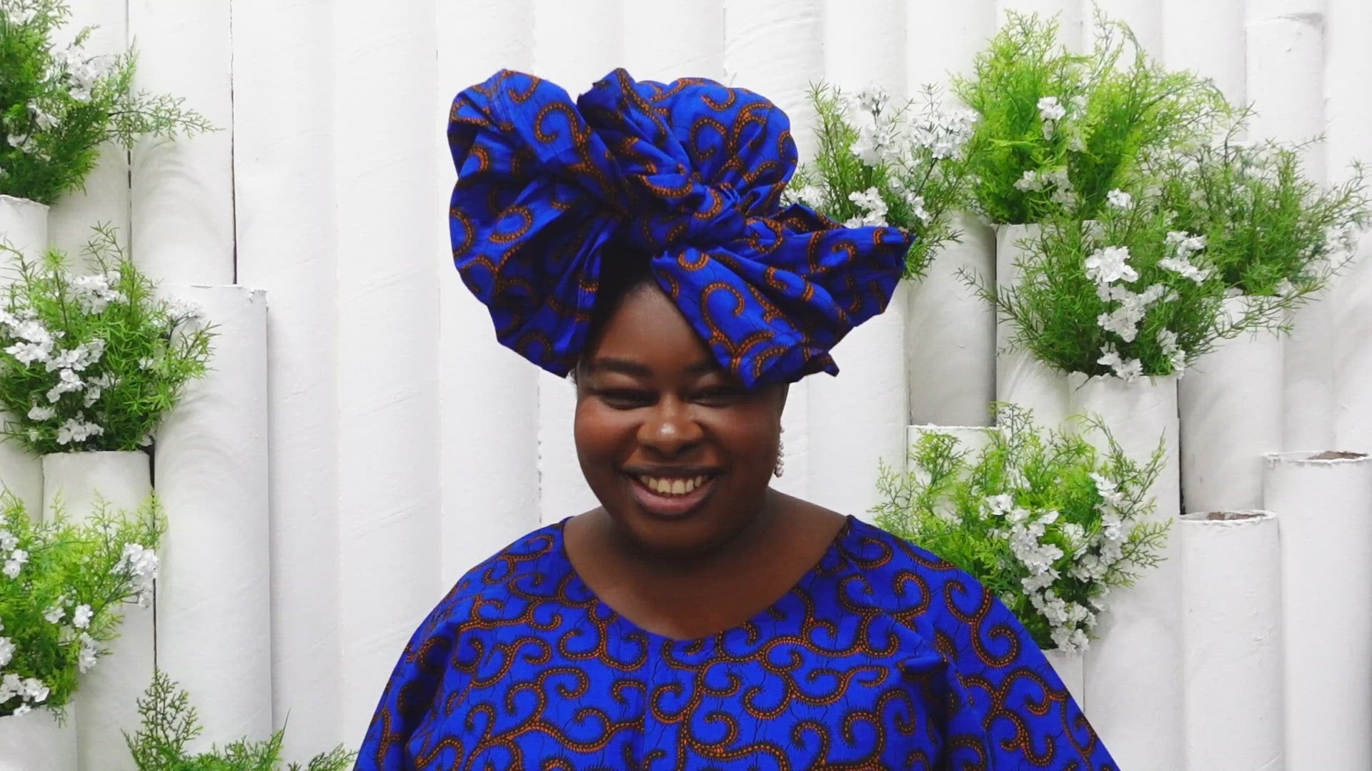 The Ore Floor Length lightweight African Print Kaftan Dress in Ankara wax print in a deep blue and orange swirling African Print pattern is ethically sourced cotton. Designed in England Made in Nigeria. 