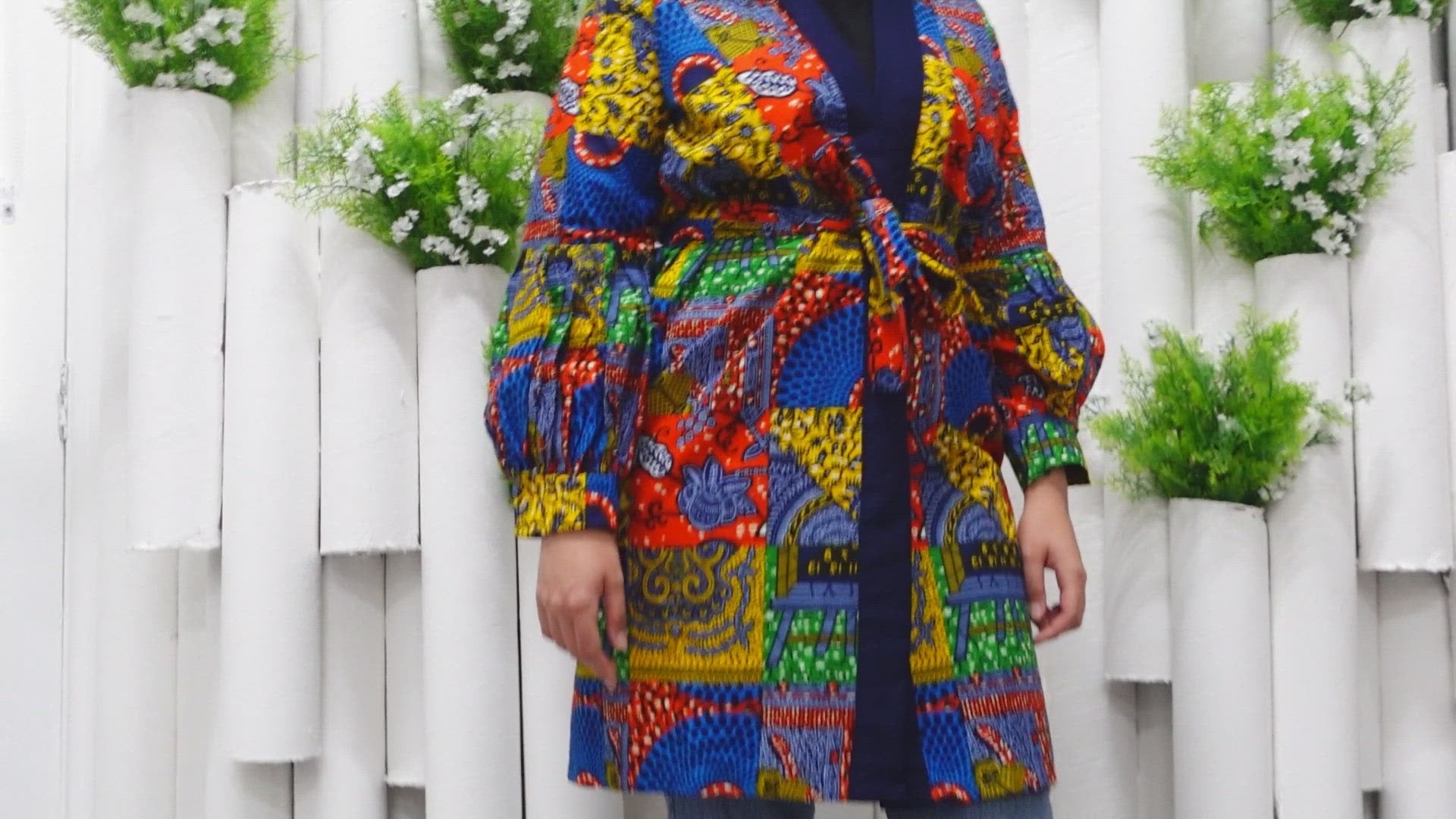 The Sade Patchwork Kimono Jacket is a vibrant multi-coloured mandala patchwork African wax Printed pattern jacket on sustainable cotton. Designed in England Made in Nigeria, Available in standard and plus sizes (UK 8-32). 