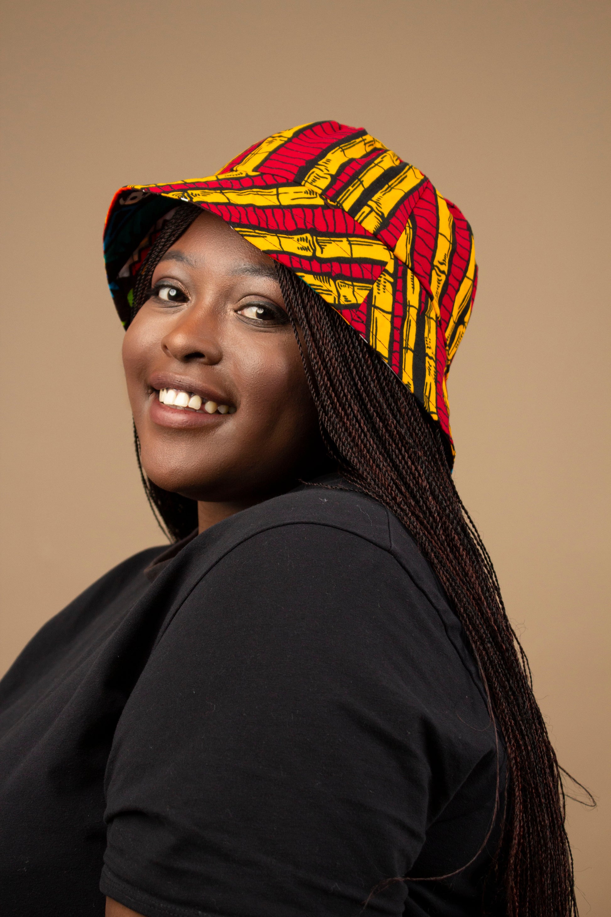 The one-sized Keji African Print Reversible Bucket Hat is made from sustainably sourced Ankara wax printed cotton in two sustainably sourced wax printed cottons - Keji & the other side is Tayo. Designed in England Made in Nigeria. 