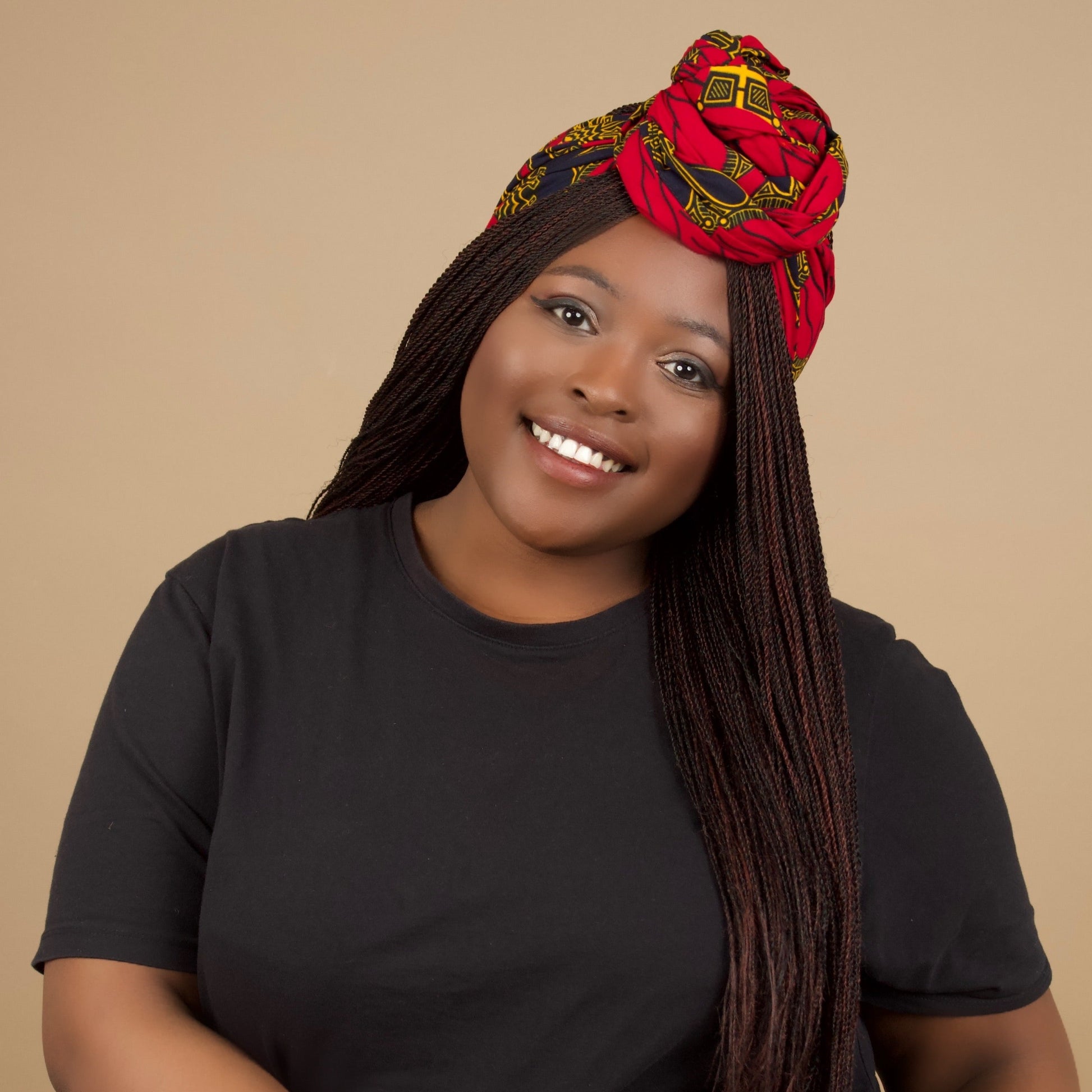 The Jalingo African Print Ankara Head Wrap is a lightweight African Print hair accessory made from ethically produced cotton. The Ankara wax print is a gorgeous red, yellow and black pattern. Designed in England Made in Nigeria.