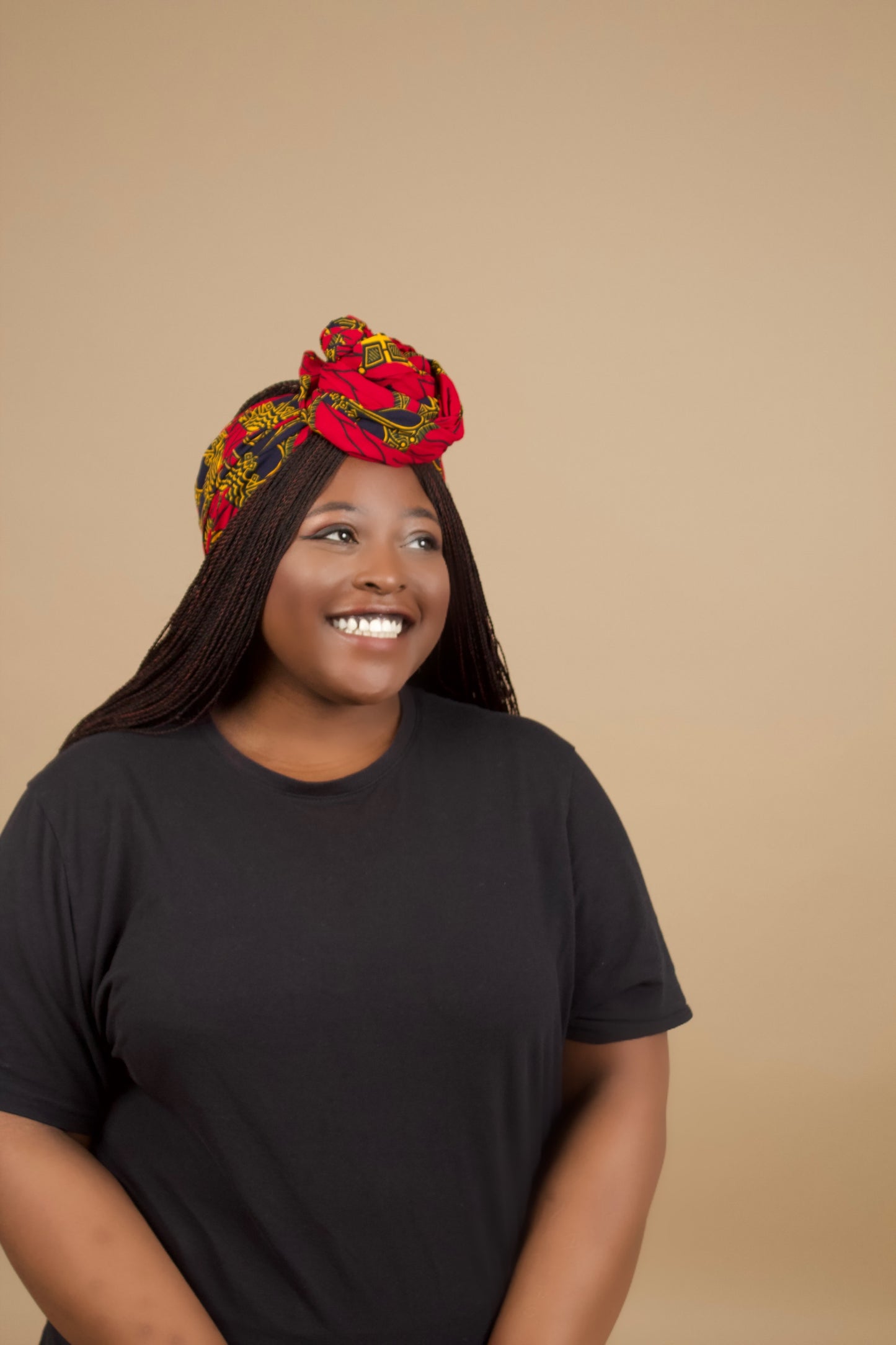 The Jalingo African Print Ankara Head Wrap is a lightweight African Print hair accessory made from ethically produced cotton. The Ankara wax print is a gorgeous red, yellow and black pattern. Designed in England Made in Nigeria.