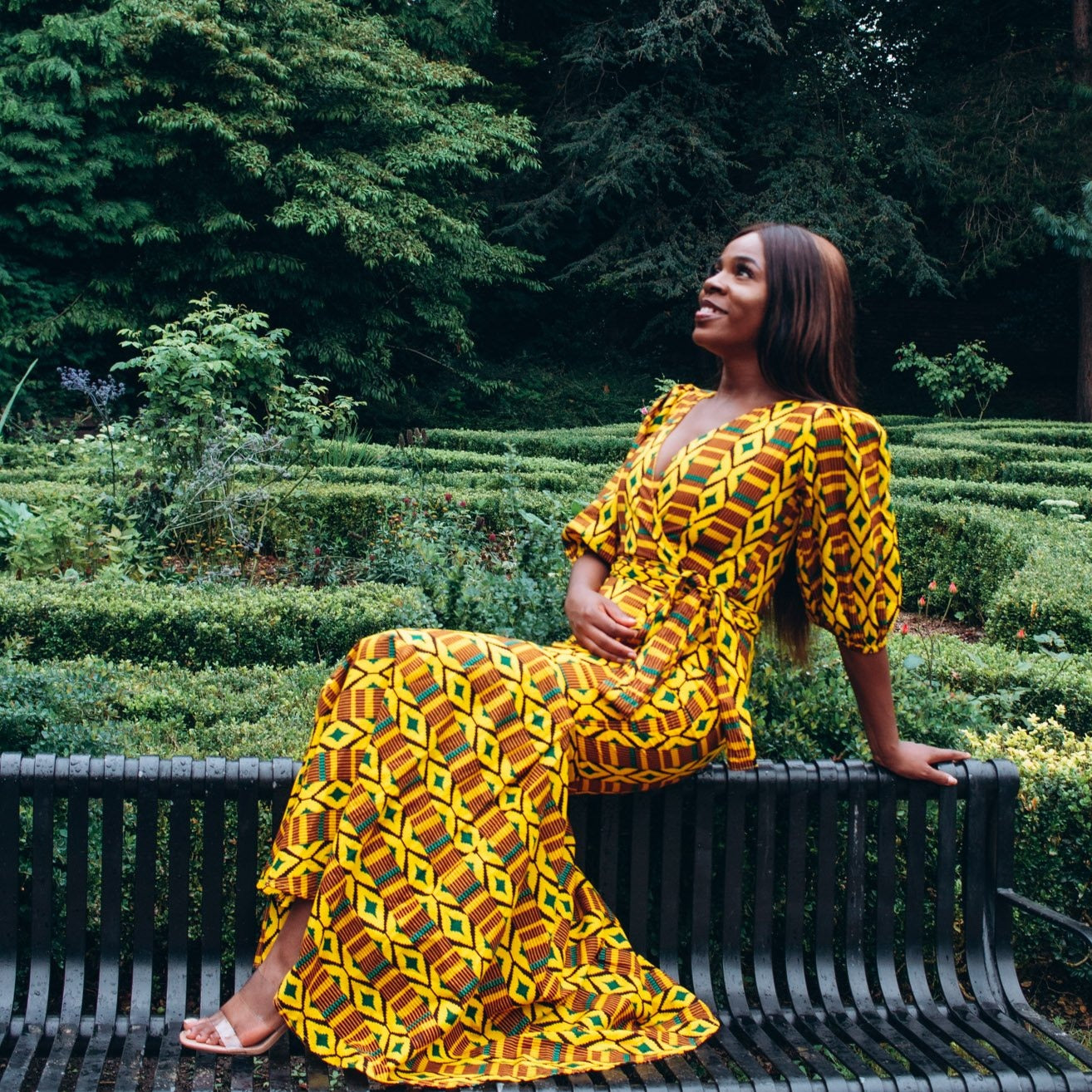 Floor length V-neck wrapped, fishtail dress featuring balloon sleeves and belt in yellow , brown, green and black Kente African Ankara wax printed Fabric.