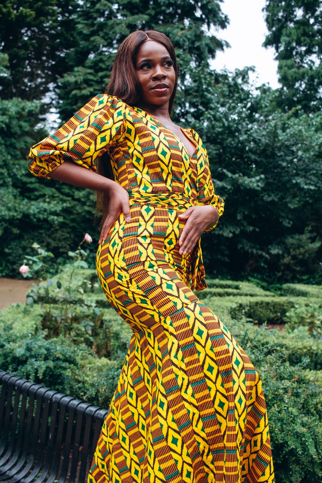 Floor length V-neck wrapped, fishtail dress featuring balloon sleeves and belt in yellow , brown, green and black Kente African Ankara wax printed Fabric.
