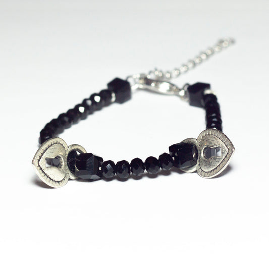 black beaded bracelet with heart locket pendants and chain clasp