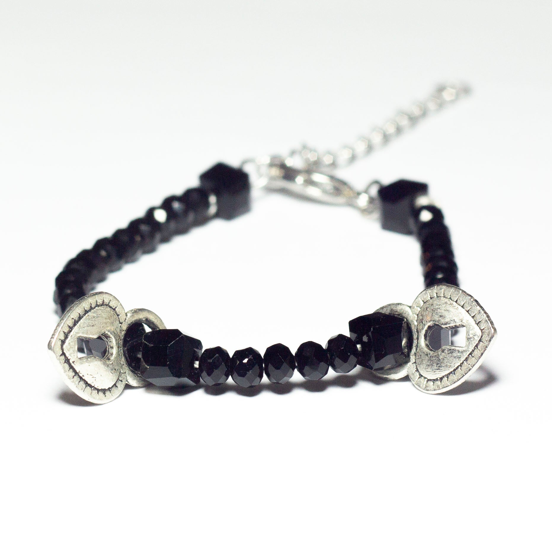 black beaded bracelet with heart locket pendants and chain clasp