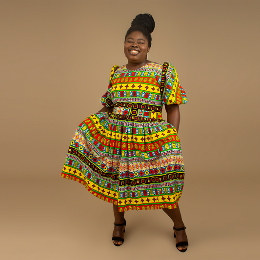 The Akala African Print Skater Dress is crafted from sustainable wax print and features two side pockets in a repeated multi-coloured geometric Kente pattern from cotton. Designed in England Made in Nigeria. Available in standard and plus sizes (UK 8-32).