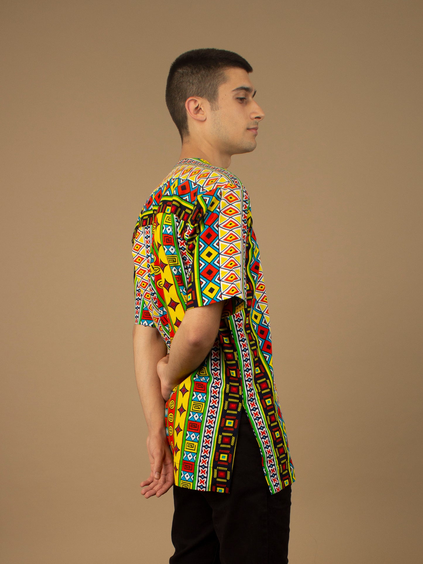 The Akala African Print Kaftan Top is ethically printed in a repeated multicolored geometric Kente African pattern with a Matte Black trim, wax printed body shirt made from sustainable Ankara wax printed cotton.. Designed in England Made in Nigeria. Available in standard and plus sizes (UK XS-5XL).