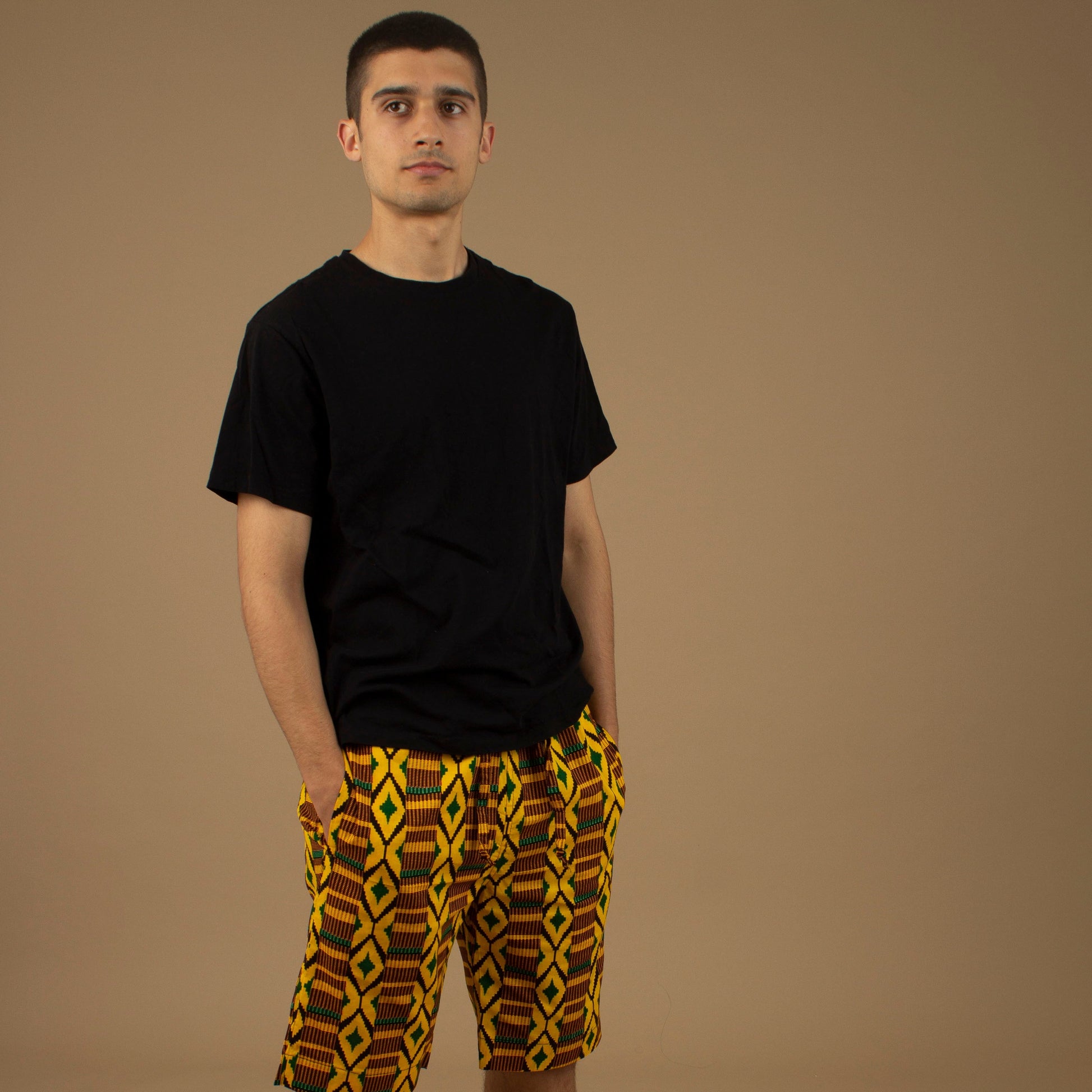 The Adina Kente African Print Shorts is a striking Diamond geometric kente pattern in green, yellow and black made from sustainably sourced 100% Cotton. Designed in England Made in Nigeria.
