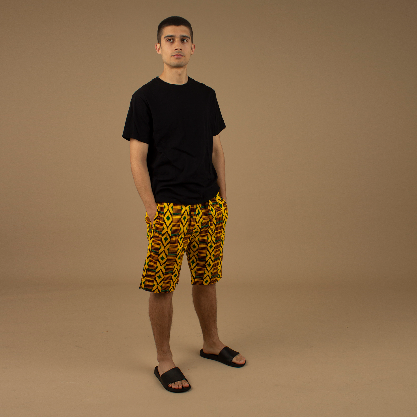 The Adina Kente African Print Shorts is a striking Diamond geometric kente pattern in green, yellow and black made from sustainably sourced 100% Cotton. Designed in England Made in Nigeria.