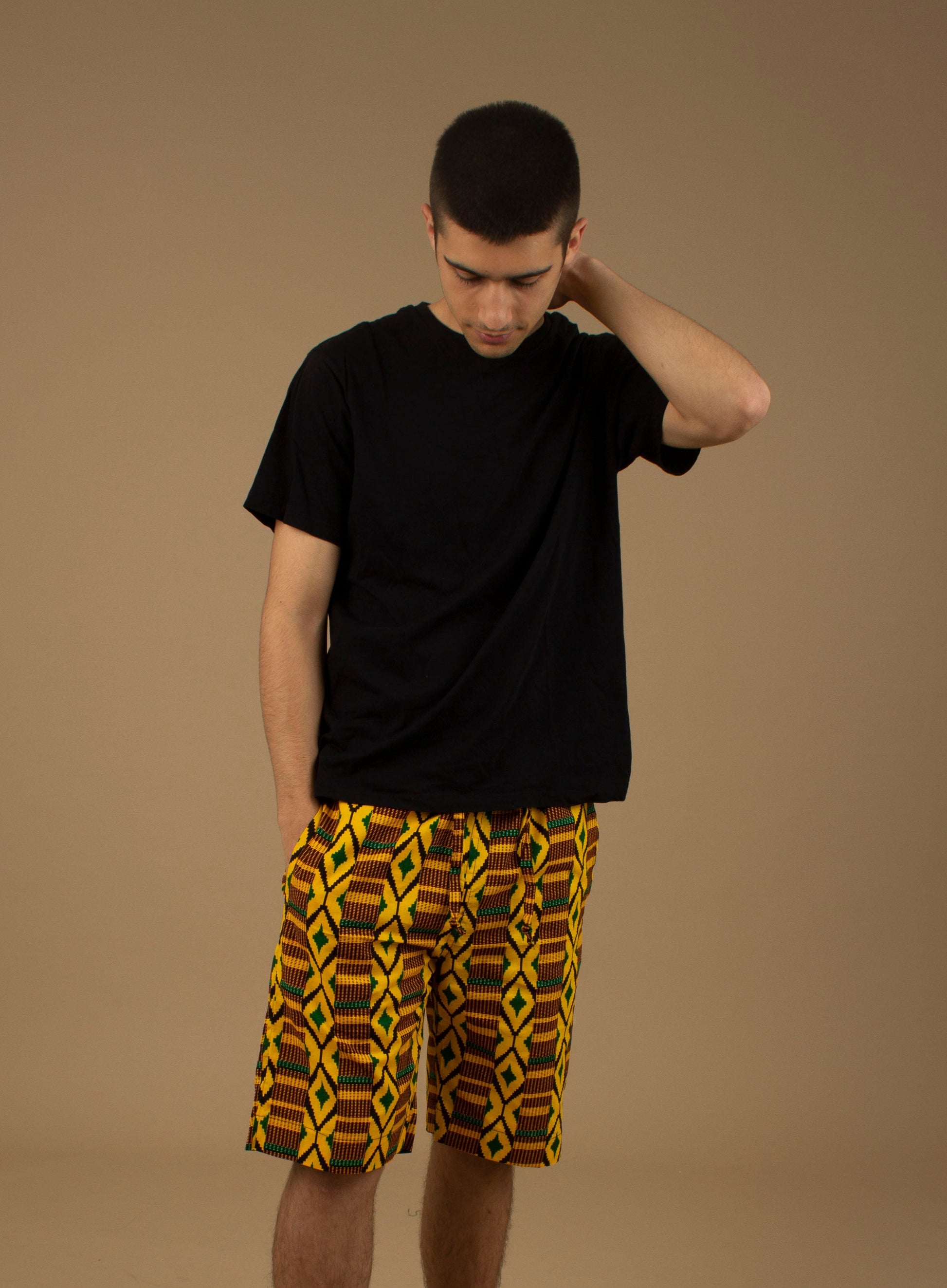 The Adina Kente African Print Shorts is a striking Diamond geometric kente pattern in green, yellow and black made from sustainably sourced 100% Cotton. Designed in England Made in Nigeria.