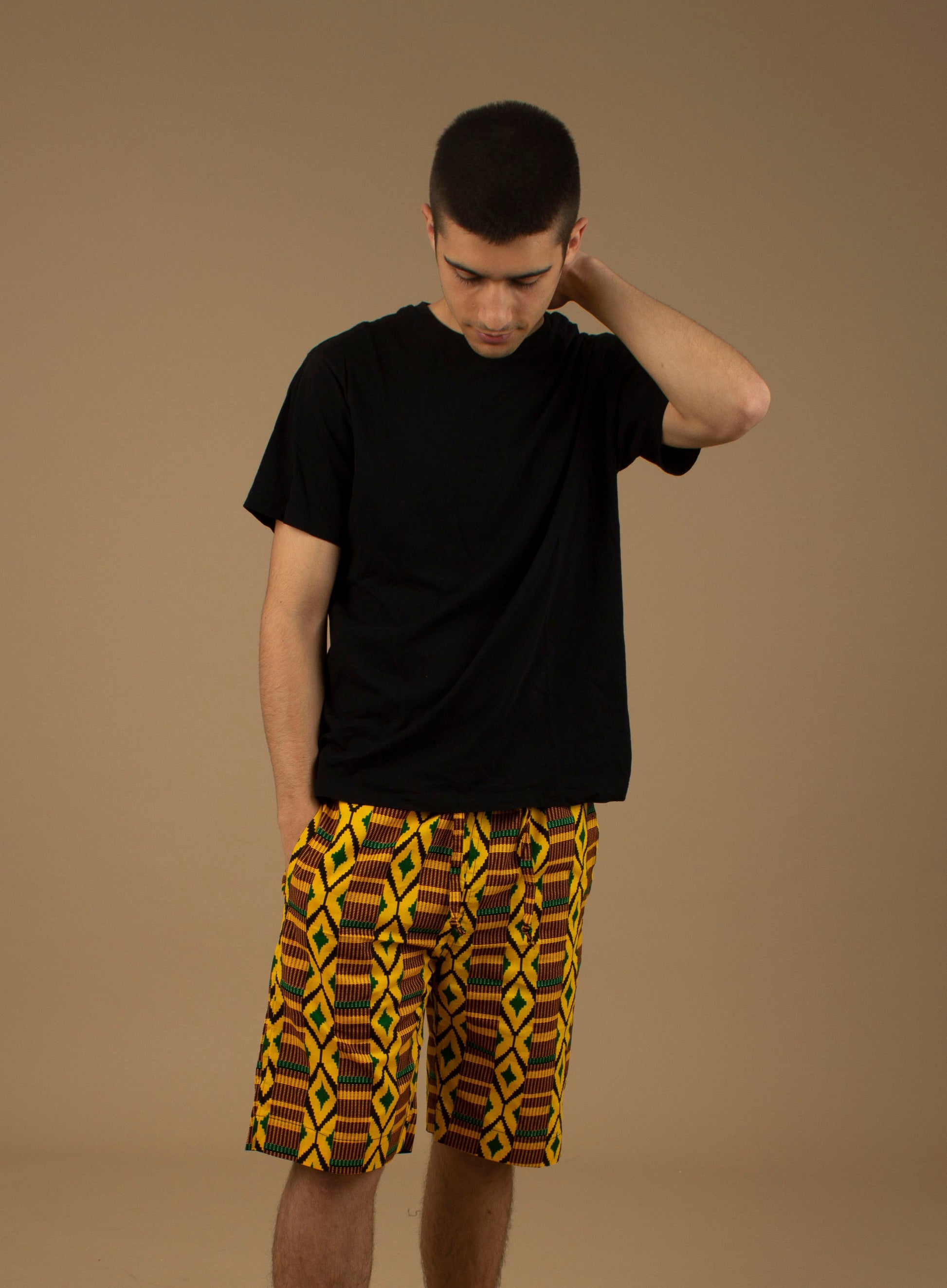 The Adina Kente African Print Shorts is a striking Diamond geometric kente pattern in green, yellow and black made from sustainably sourced 100% Cotton. Designed in England Made in Nigeria.