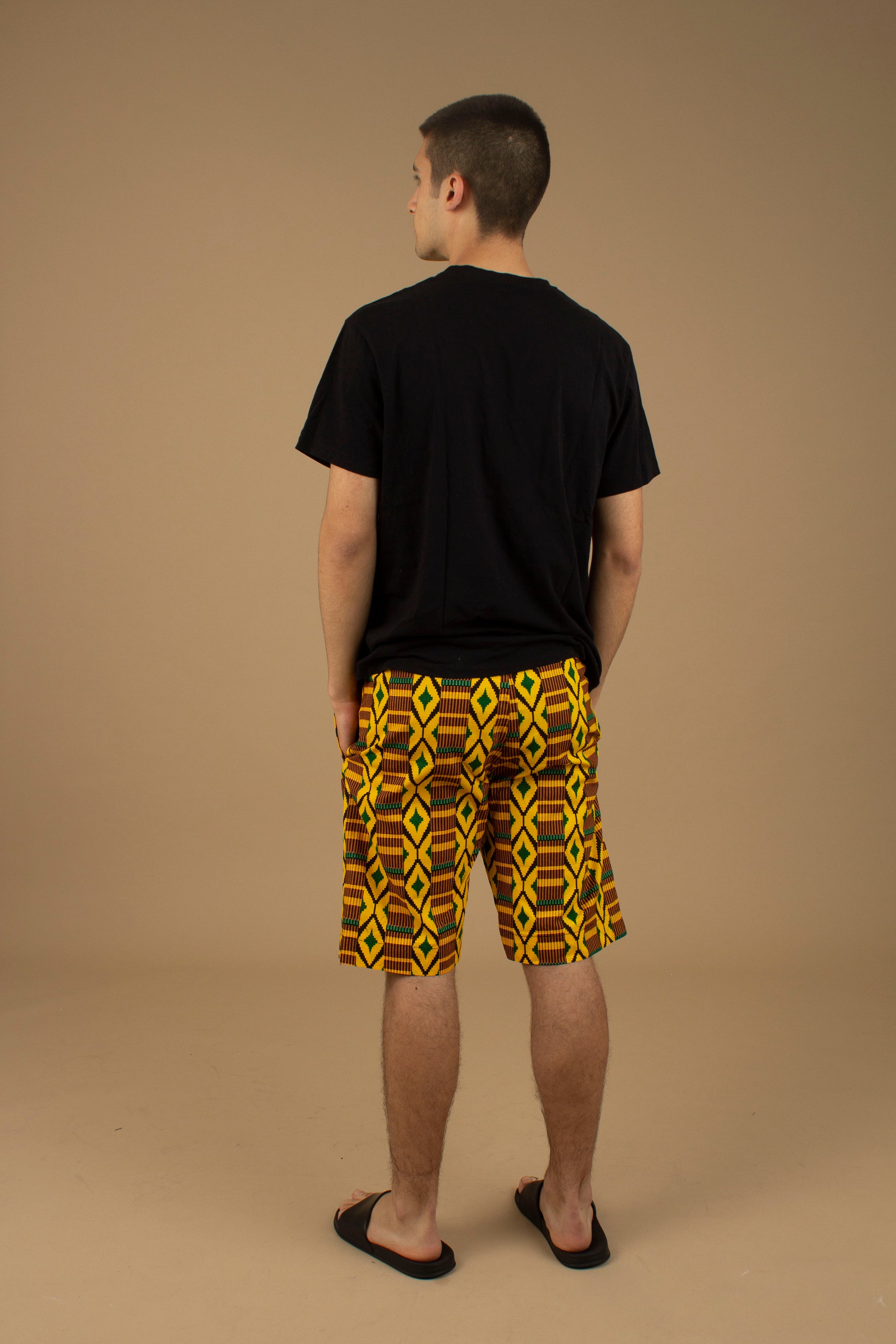 The Adina Kente African Print Shorts is a striking Diamond geometric kente pattern in green, yellow and black made from sustainably sourced 100% Cotton. Designed in England Made in Nigeria.