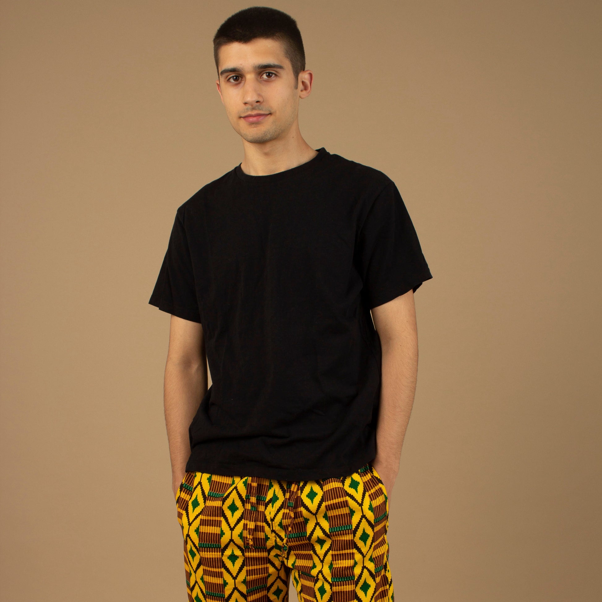 The Adina Kente African Print Shorts is a striking Diamond geometric kente pattern in green, yellow and black made from sustainably sourced 100% Cotton. Designed in England Made in Nigeria.