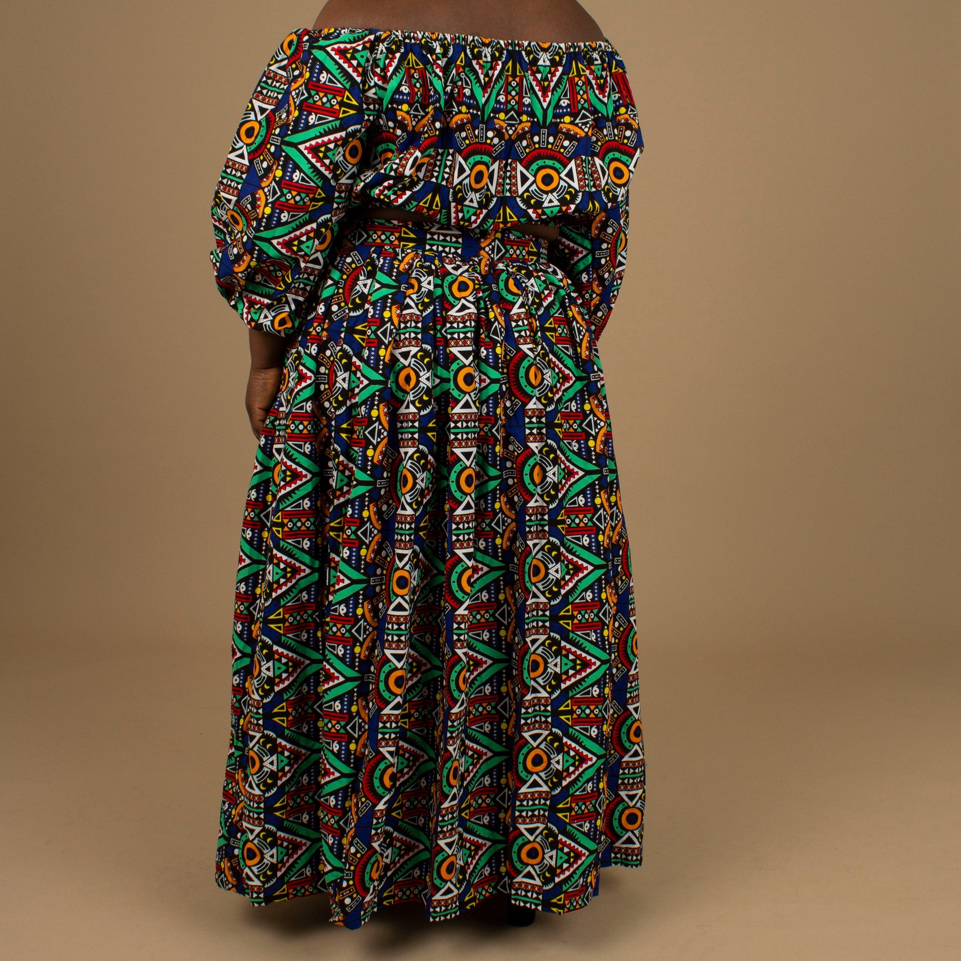 The Ifemi Floor Length African Print High Waisted Maxi Skirt with an enforced waistband and zip in a vibrant Ankara wax, geometric multicolored pattern using sustainable ethically sourced Cotton, designed in England Made in Nigeria.