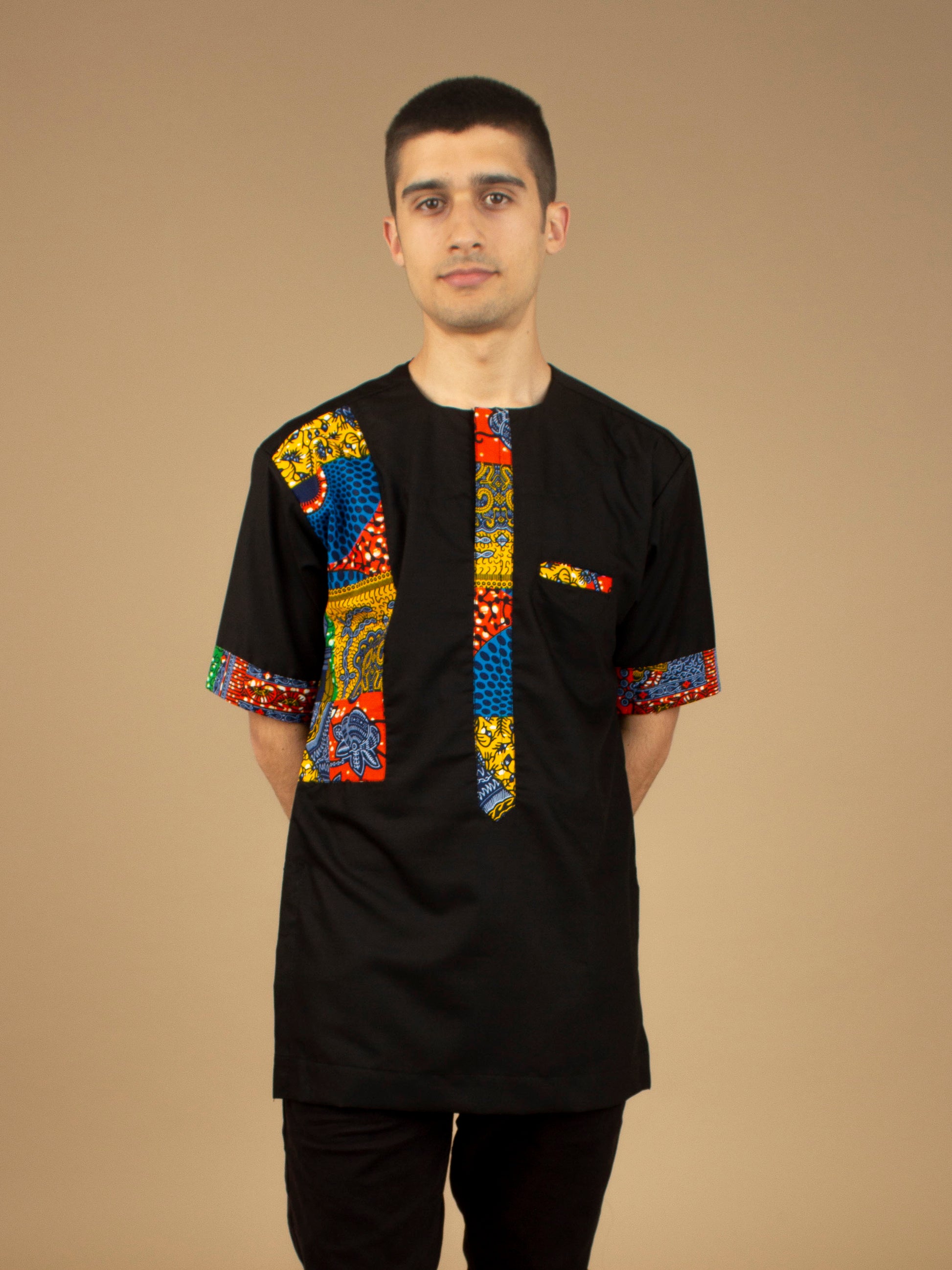 The Sade Patchwork Kaftan Top is a linen fabric trimmed with sustainable Ankara wax print in a vibrant multi-coloured mandala patchwork pattern. Designed in England Made in Nigeria, Available in standard and plus sizes (UK XS-5XL). 