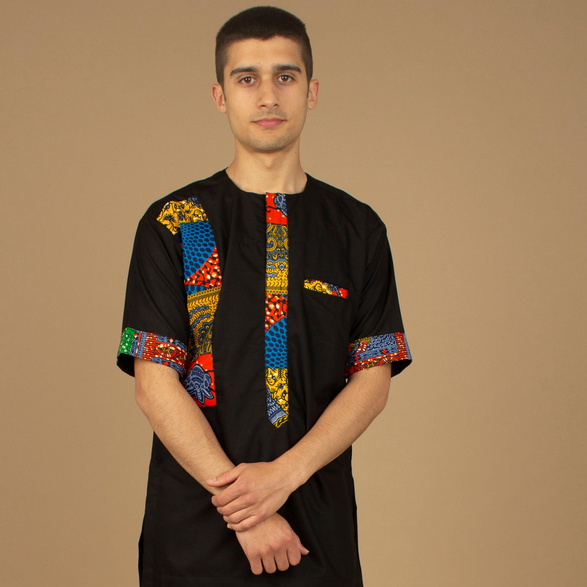 The Sade Patchwork Kaftan Top is a linen fabric trimmed with sustainable Ankara wax print in a vibrant multi-coloured mandala patchwork pattern. Designed in England Made in Nigeria, Available in standard and plus sizes (UK XS-5XL). 