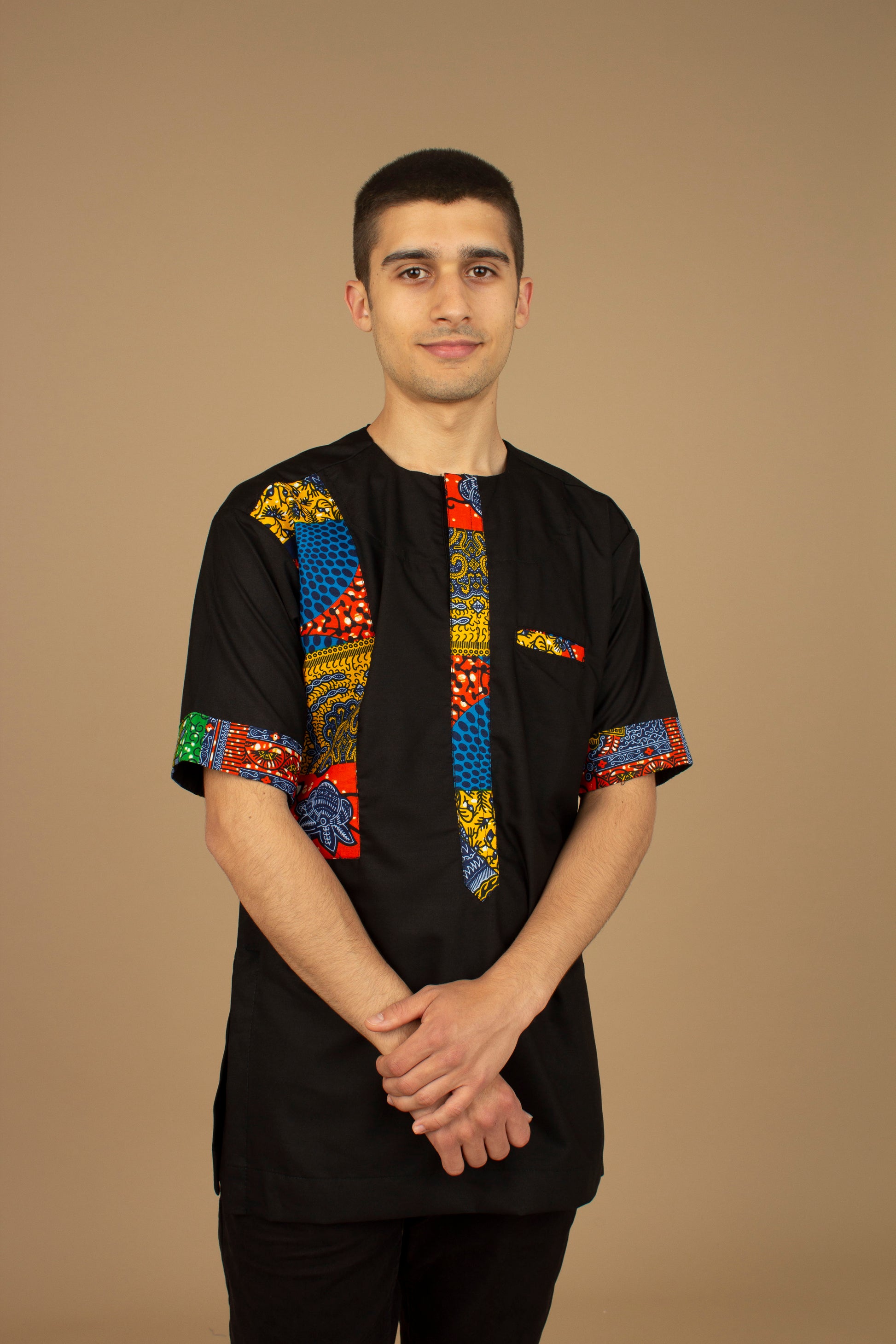 The Sade Patchwork Kaftan Top is a linen fabric trimmed with sustainable Ankara wax print in a vibrant multi-coloured mandala patchwork pattern. Designed in England Made in Nigeria, Available in standard and plus sizes (UK XS-5XL). 