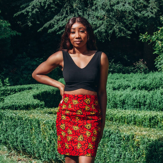 Red, yellow and black African print high waisted pencil skirt in a floral pattern, made from sustainably sourced Ankara wax print.