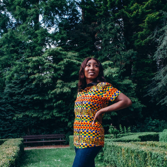  Kente African Printed  black round neck collared slim fitted Shirt made from yellow , red, blue, green, white and black Kente African Ankara wax printed Fabric.