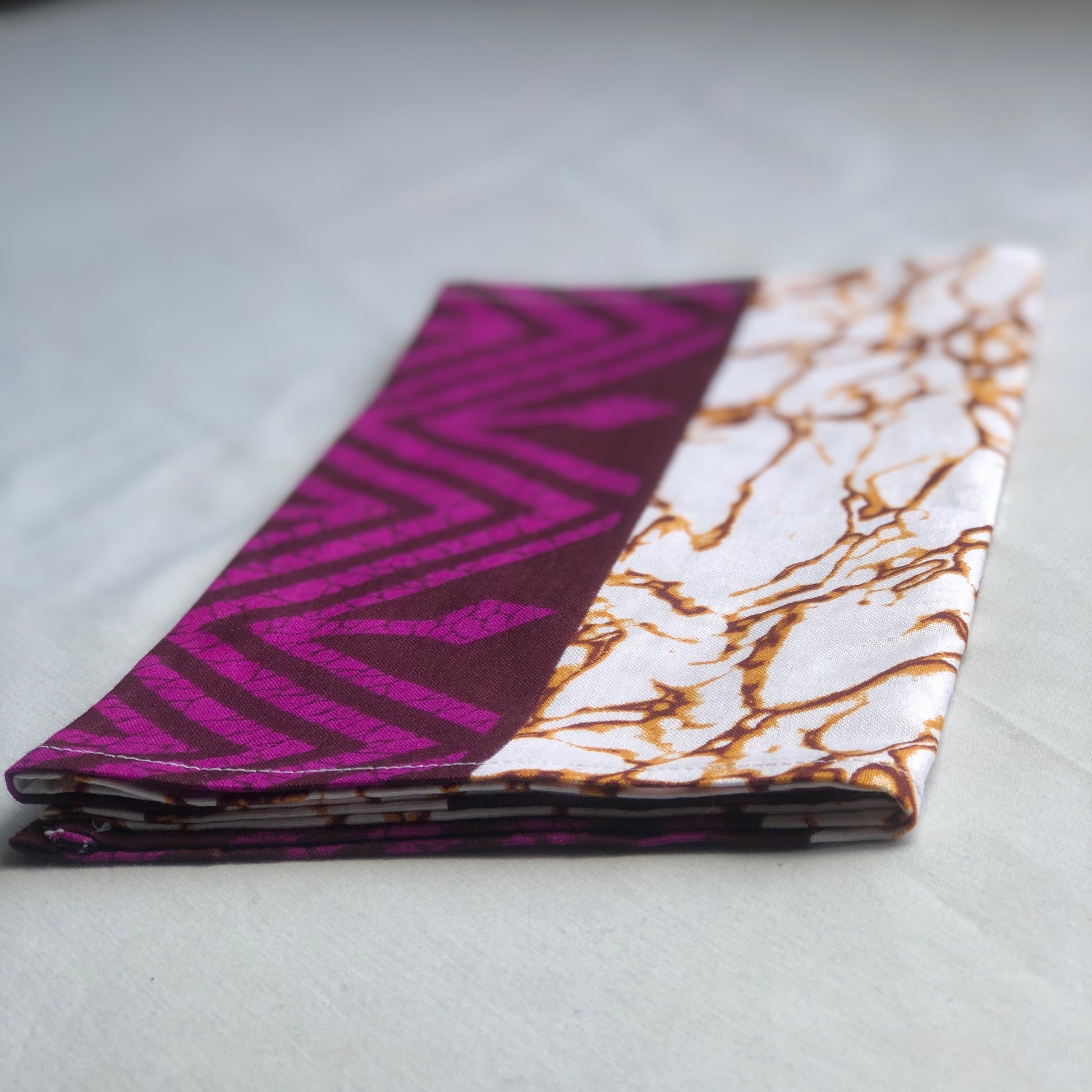 Purple, brown, and white African print head wrap fabric in a granite pattern, made from sustainably sourced Ankara wax print. 