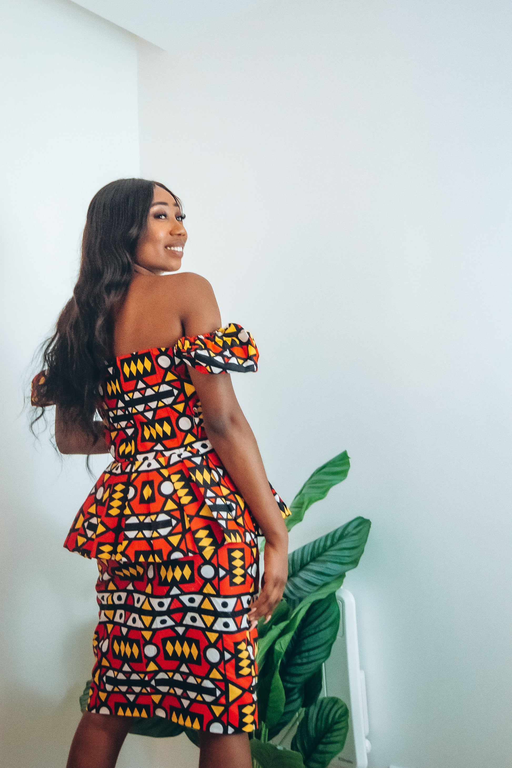 Red, pastel yellow, white and black African printKnee length pencil  skirt, in oversized geo-shaped pattern made from sustainably sourced Ankara wax print