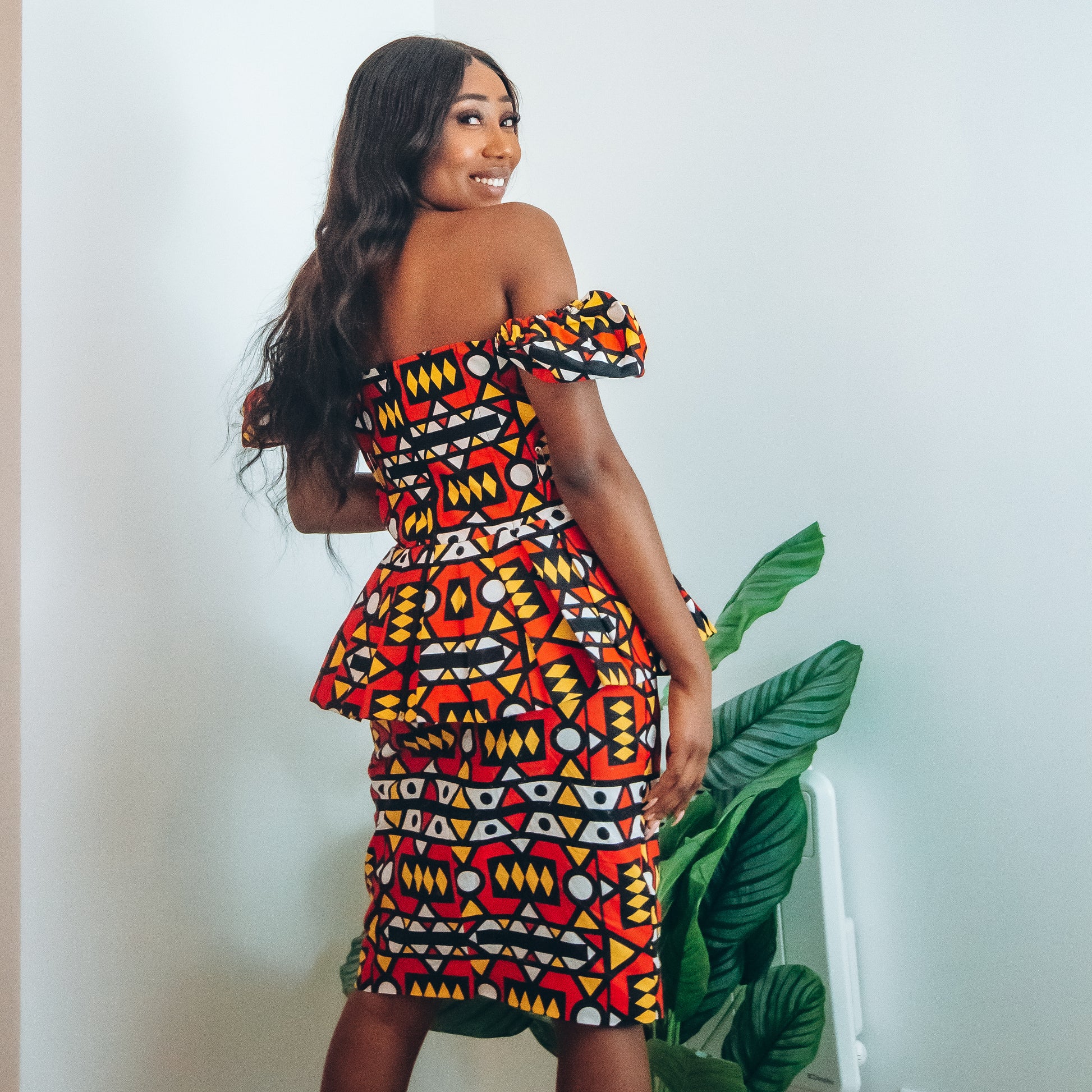 Red, pastel yellow, white and black African printKnee length pencil  skirt, in oversized geo-shaped pattern made from sustainably sourced Ankara wax print