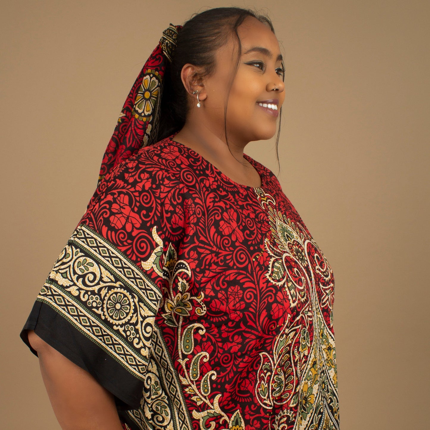 The Dashiki Floor Length Kaftan Dress in a lightweight Chiffon Fabric in a gorgeous rich red, white, black and gold floral mandala African Print pattern. Designed in England Made in Nigeria. 