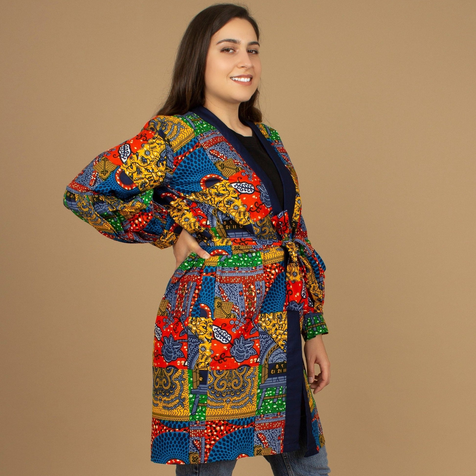 The Sade Patchwork Kimono Jacket is a vibrant multi-coloured mandala patchwork African wax Printed pattern jacket on sustainable cotton. Designed in England Made in Nigeria, Available in standard and plus sizes (UK 8-32). 