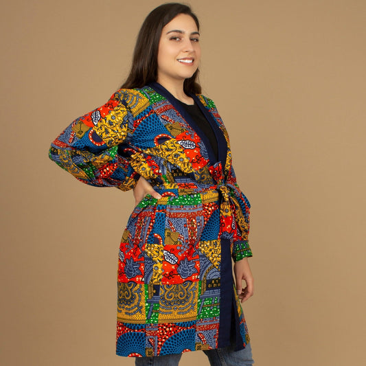 The Sade Patchwork Kimono Jacket is a vibrant multi-coloured mandala patchwork African wax Printed pattern jacket on sustainable cotton. Designed in England Made in Nigeria, Available in standard and plus sizes (UK 8-32). 