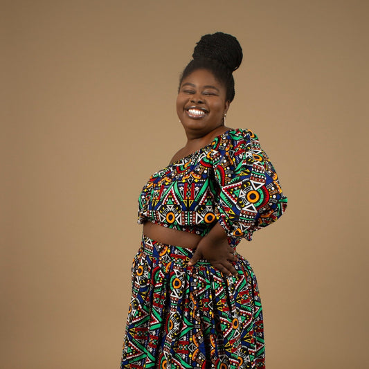 The Ifemi Floor Length African Print High Waisted Maxi Skirt with an enforced waistband and zip in a vibrant Ankara wax, geometric multicolored pattern using sustainable ethically sourced Cotton, designed in England Made in Nigeria.