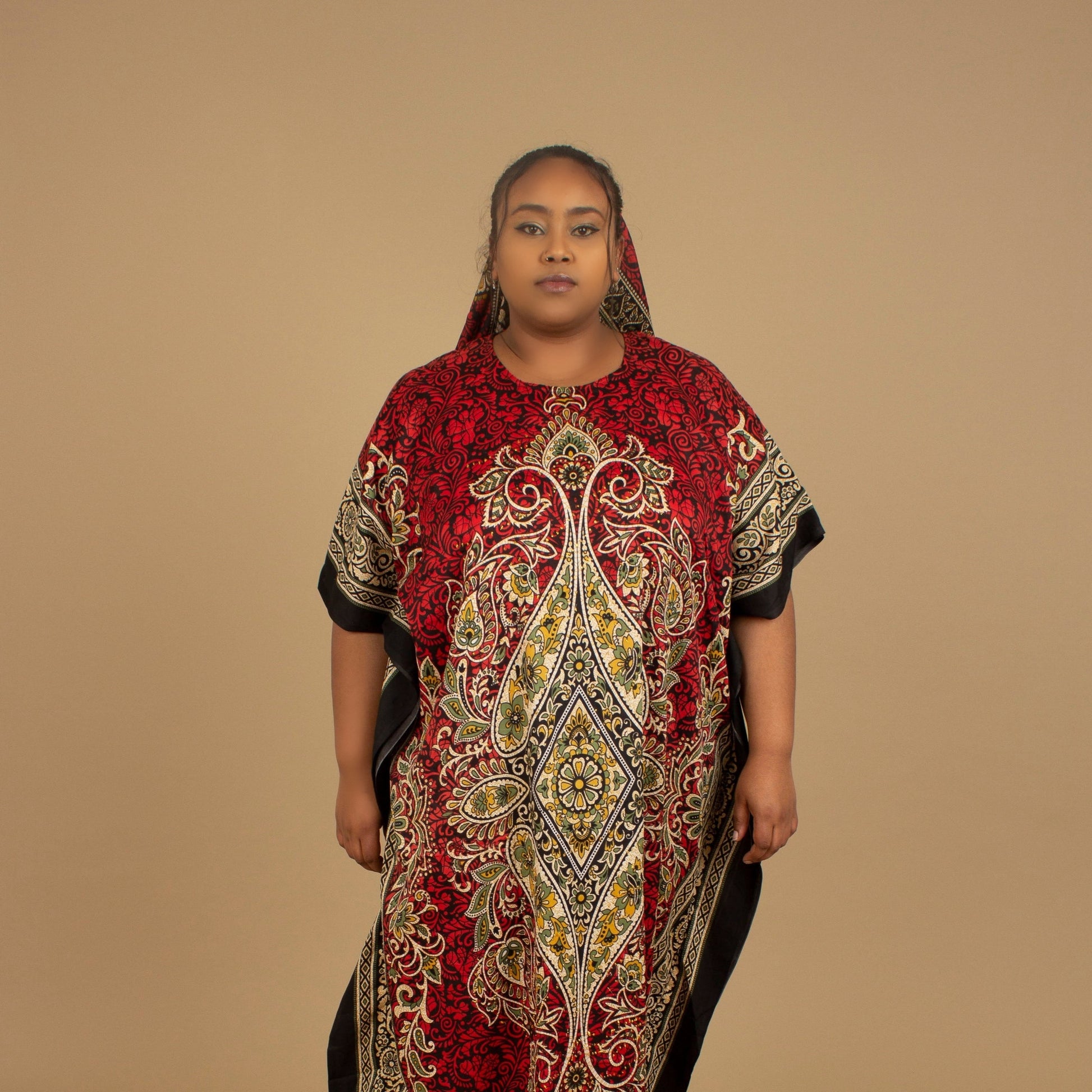 The Dashiki Floor Length Kaftan Dress in a lightweight Chiffon Fabric in a gorgeous rich red, white, black and gold floral mandala African Print pattern. Designed in England Made in Nigeria. 