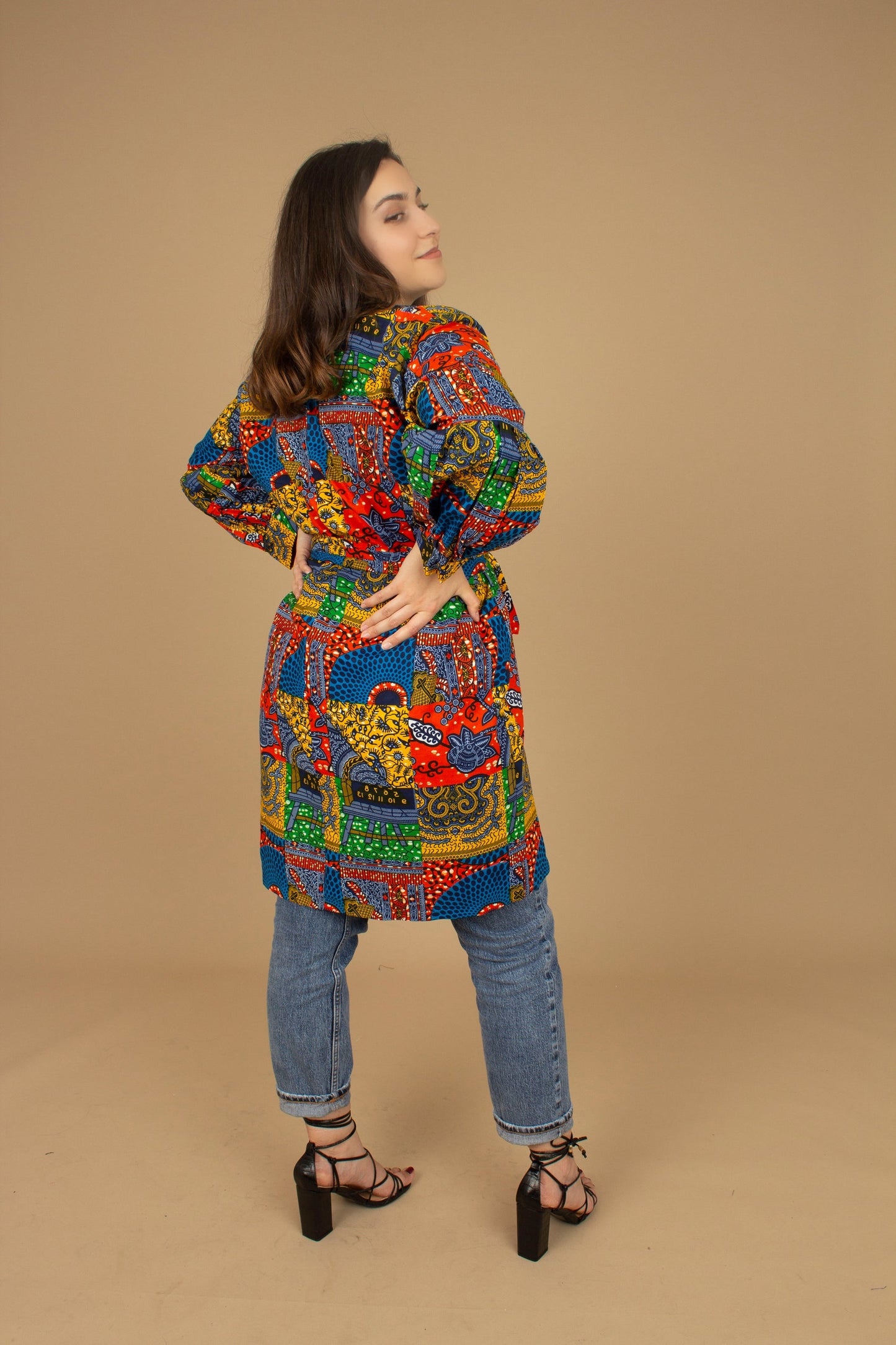 The Sade Patchwork Kimono Jacket is a vibrant multi-coloured mandala patchwork African wax Printed pattern jacket on sustainable cotton. Designed in England Made in Nigeria, Available in standard and plus sizes (UK 8-32). 