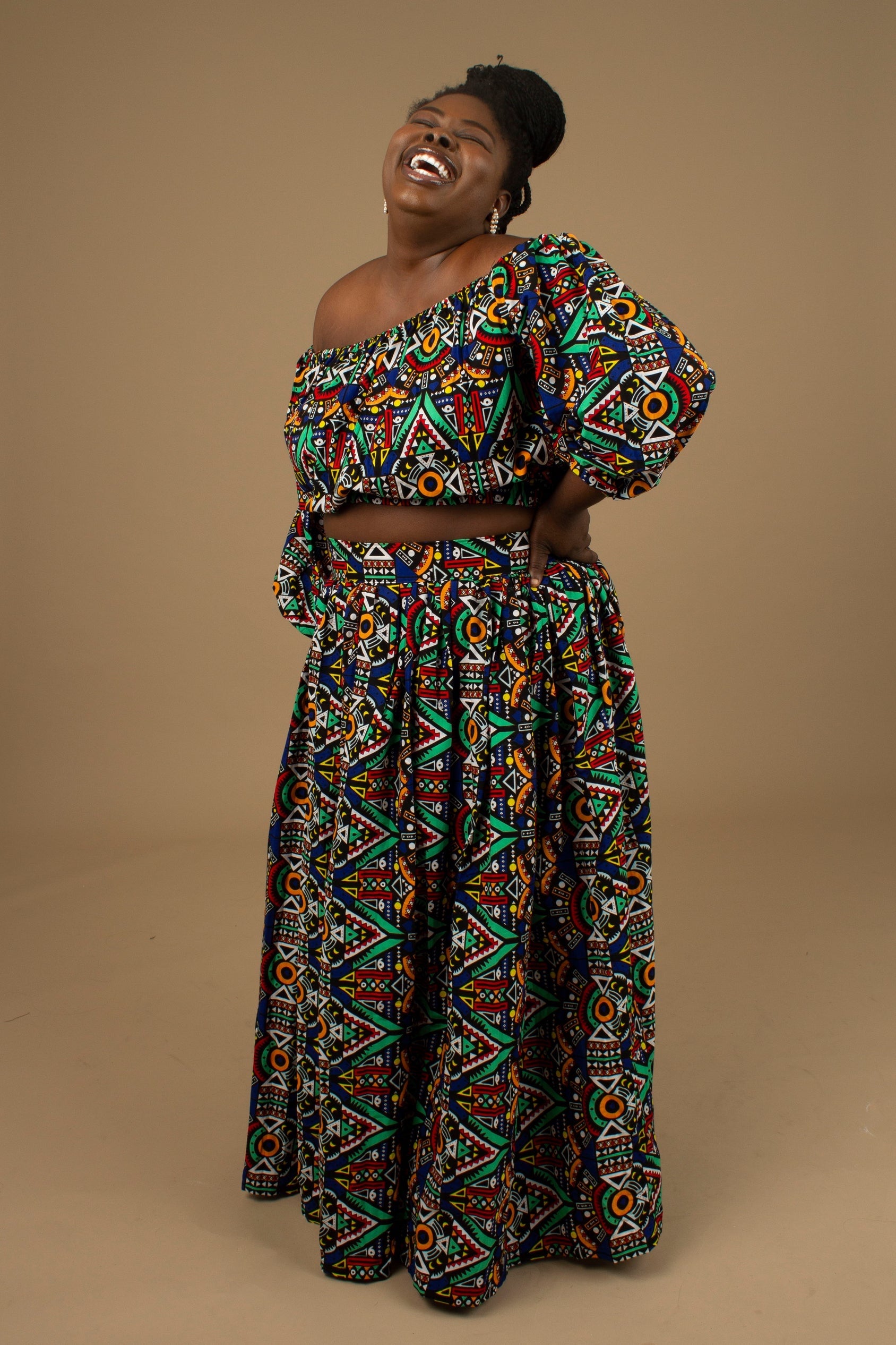Ifemi Balloon Sleeved Crop Top with an elasticated neckline in a vibrant Ankara wax, geometric multicolored pattern using sustainable ethically sourced Cotton, designed in England Made in Nigeria.