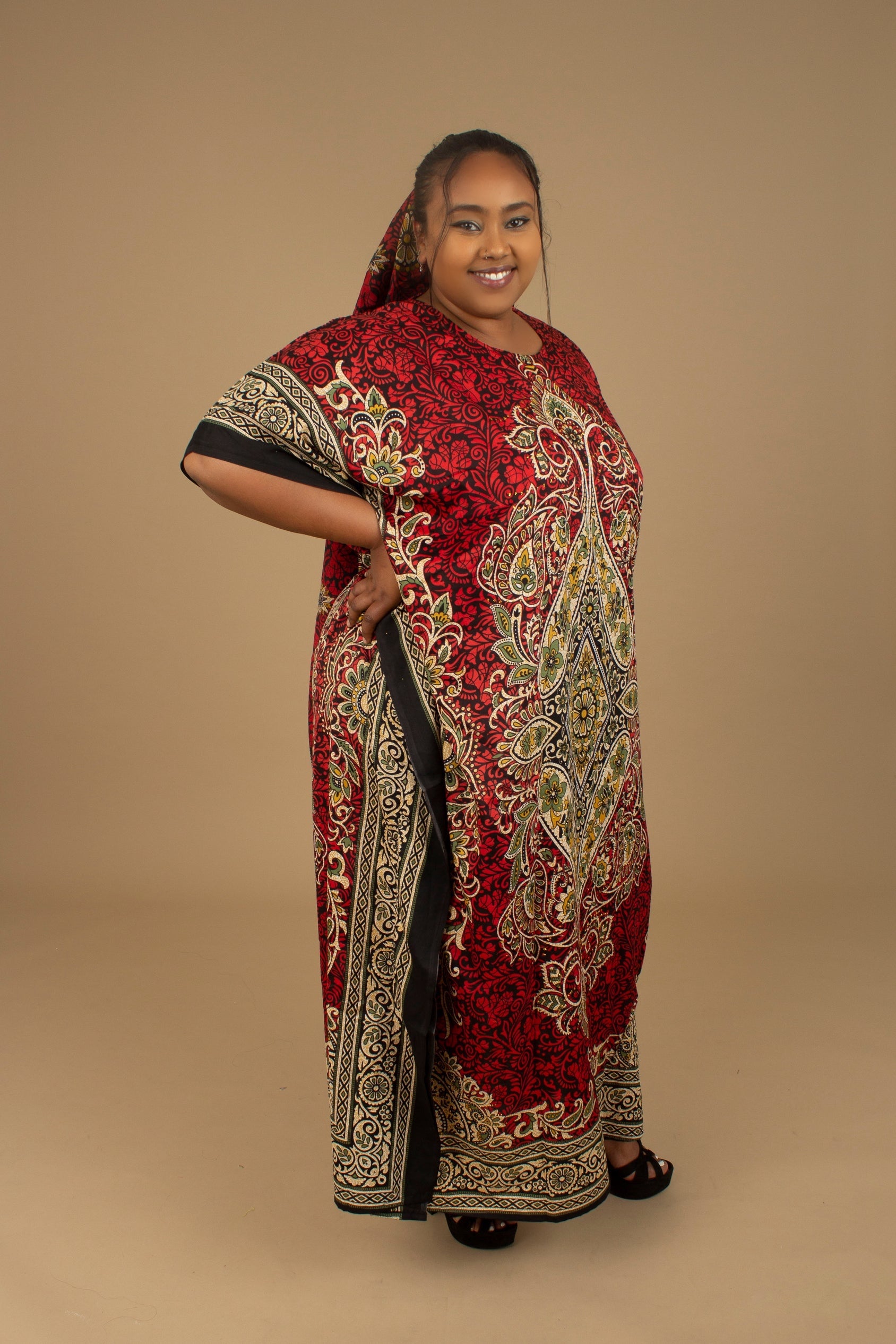 The Dashiki Floor Length Kaftan Dress in a lightweight Chiffon Fabric in a gorgeous rich red, white, black and gold floral mandala African Print pattern. Designed in England Made in Nigeria. 