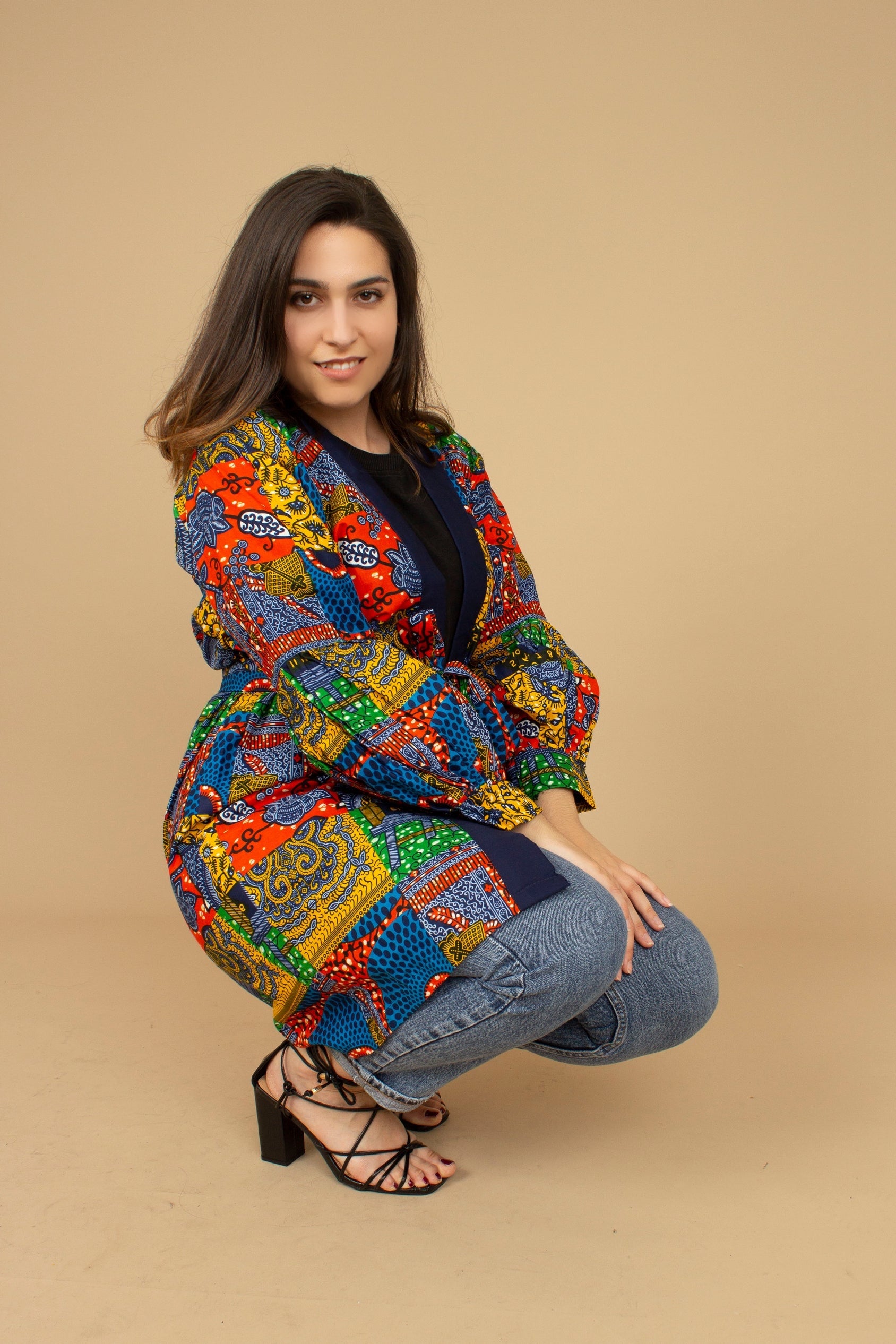 The Sade Patchwork Kimono Jacket is a vibrant multi-coloured mandala patchwork African wax Printed pattern jacket on sustainable cotton. Designed in England Made in Nigeria, Available in standard and plus sizes (UK 8-32). 