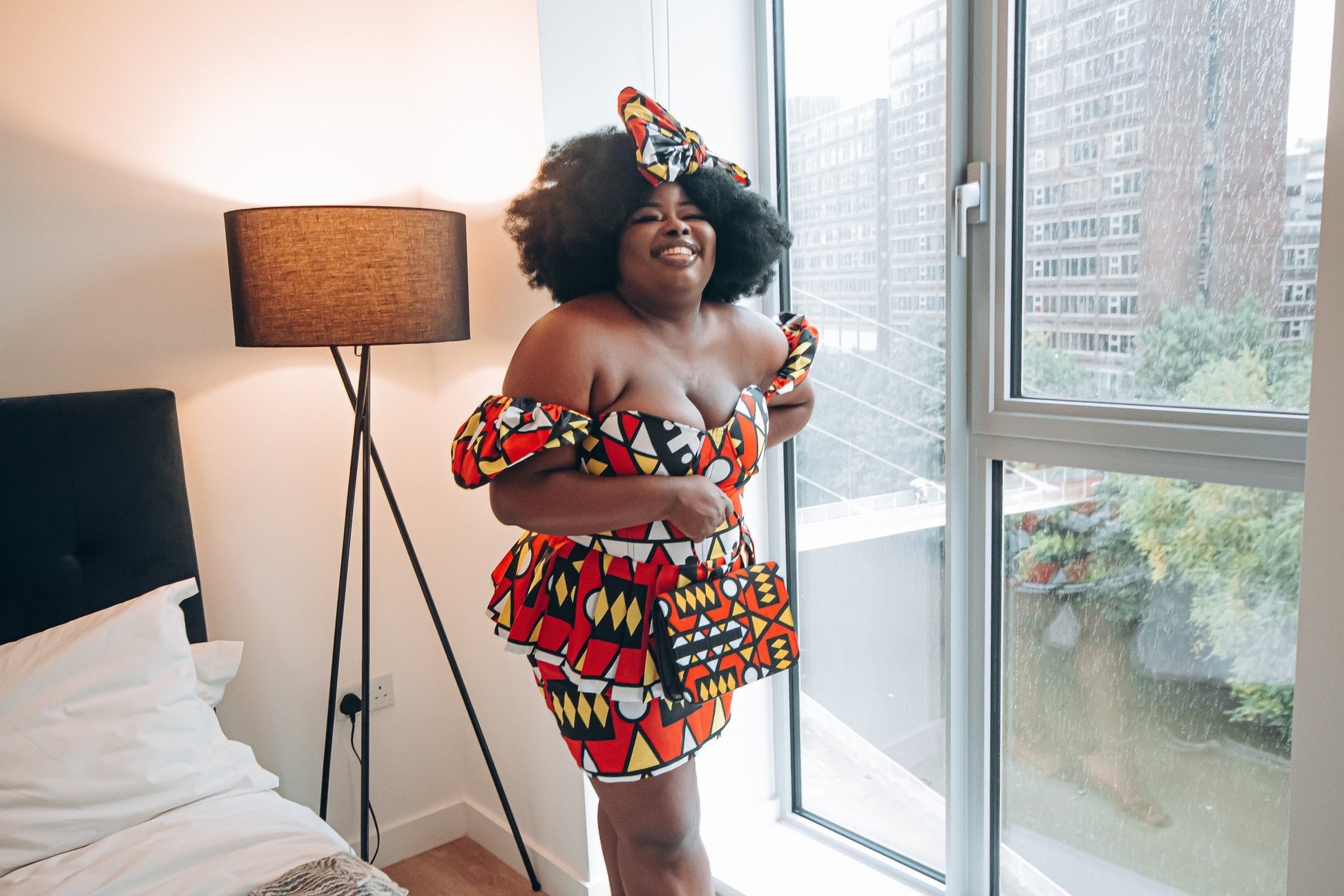 Red, pastel yellow, white and black African printKnee length pencil  skirt, in oversized geo-shaped pattern made from sustainably sourced Ankara wax print