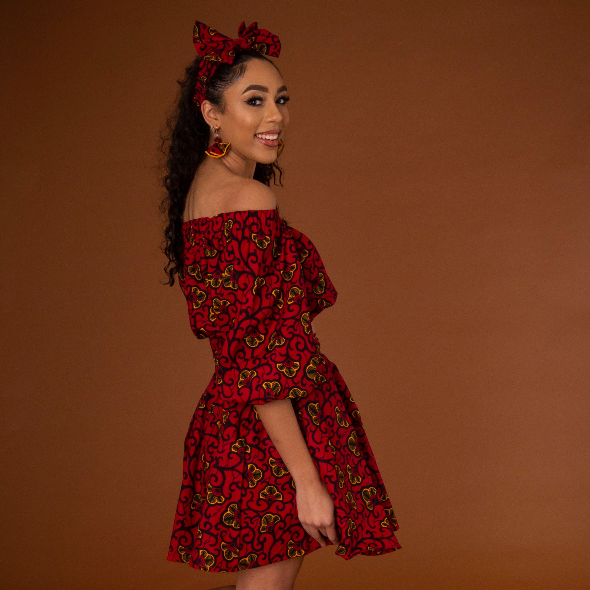 African print balloon sleeve crop top and matching high waisted flare skirt a striking red, yellow and black ankara fabric
