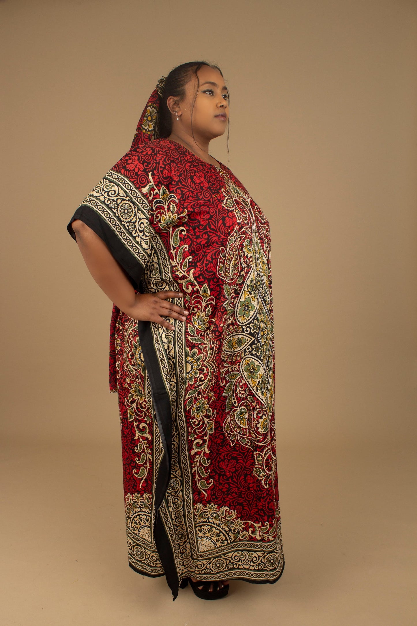 The Dashiki Floor Length Kaftan Dress in a lightweight Chiffon Fabric in a gorgeous rich red, white, black and gold floral mandala African Print pattern. Designed in England Made in Nigeria. 